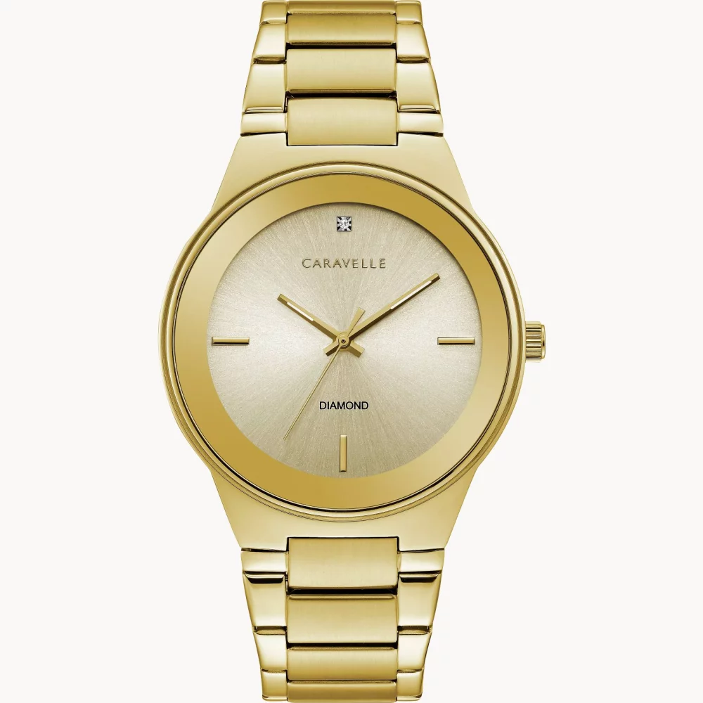 Montre moderne pour homme de la collection Caravelle® en or avec cadran rond champagne en or.