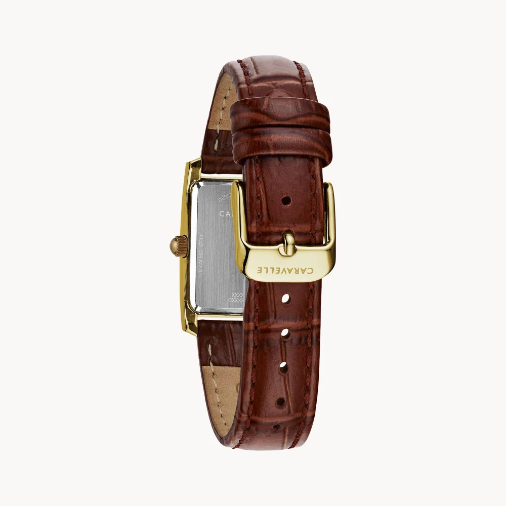 Montre pour femme de la collection Caravelle® avec bracelet en cuir de crocodile, couleur or.