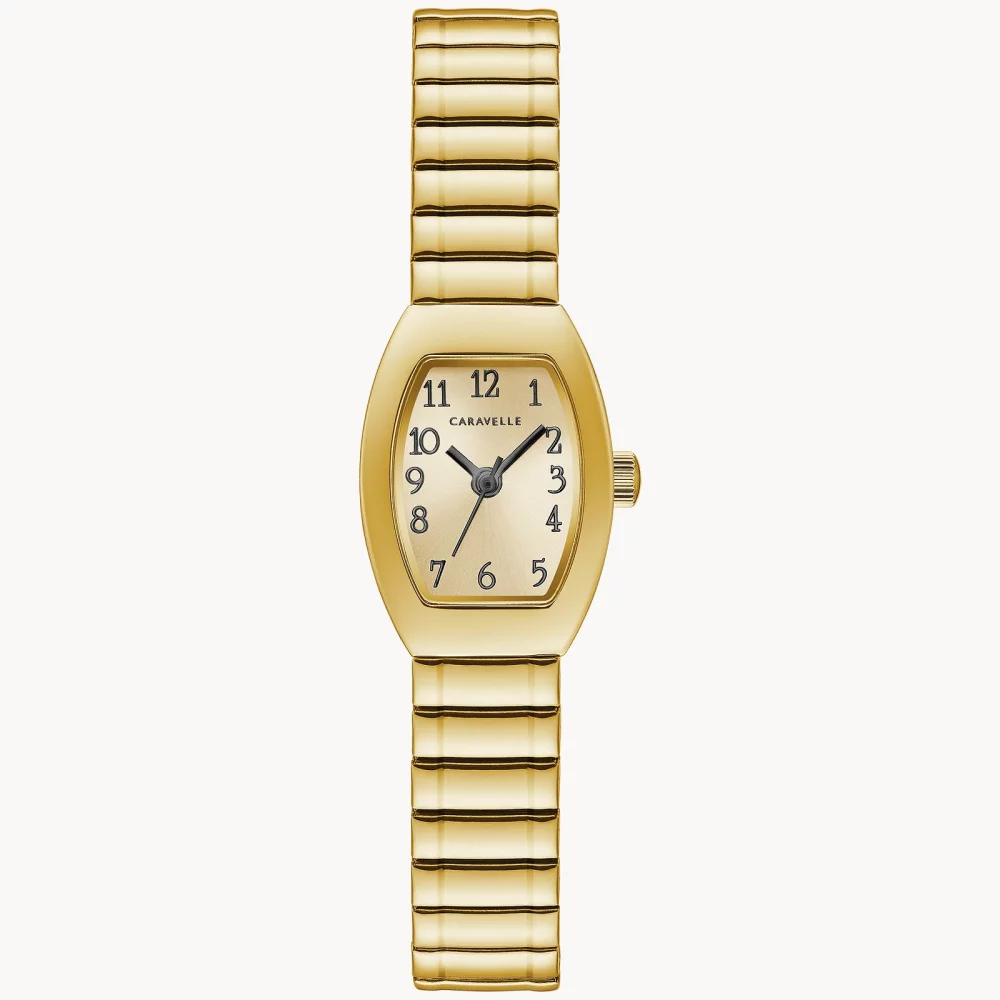 Montre traditionnelle pour femmes de la collection Caravelle® en or avec cadran tonneau champagne en or.