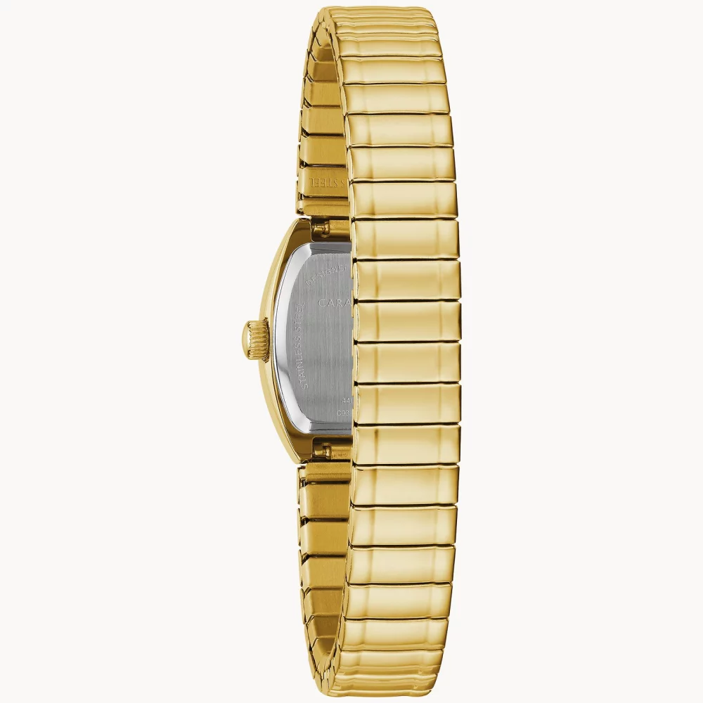 Montre traditionnelle pour femmes de la collection Caravelle® en or avec cadran tonneau champagne en or.
