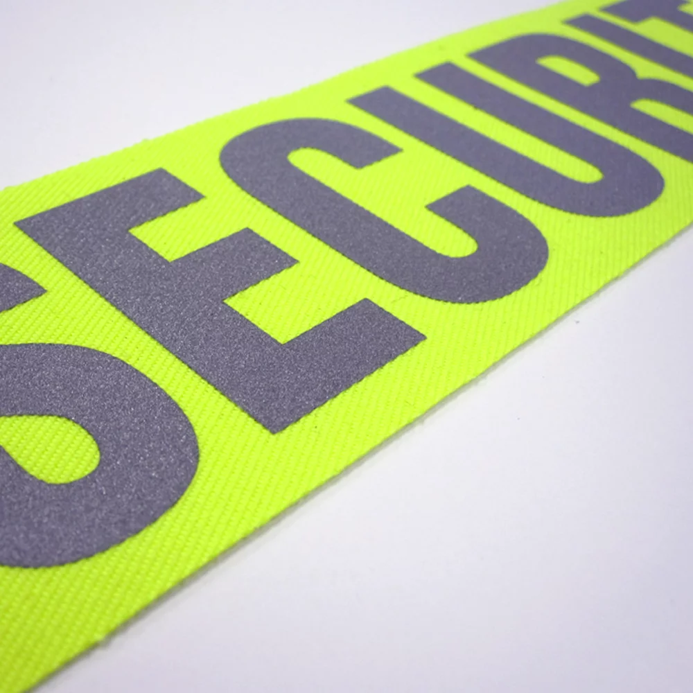 Emblèmes de transfert réfléchissants