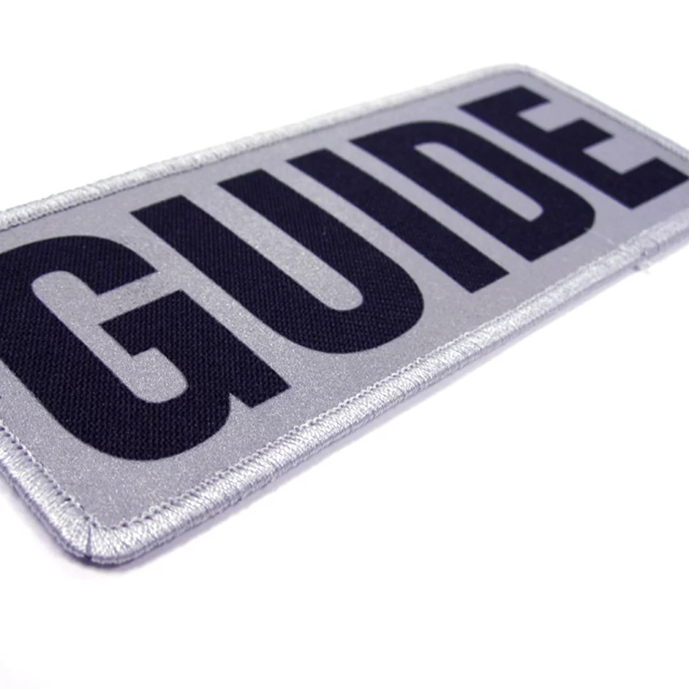 Emblèmes de transfert réfléchissants