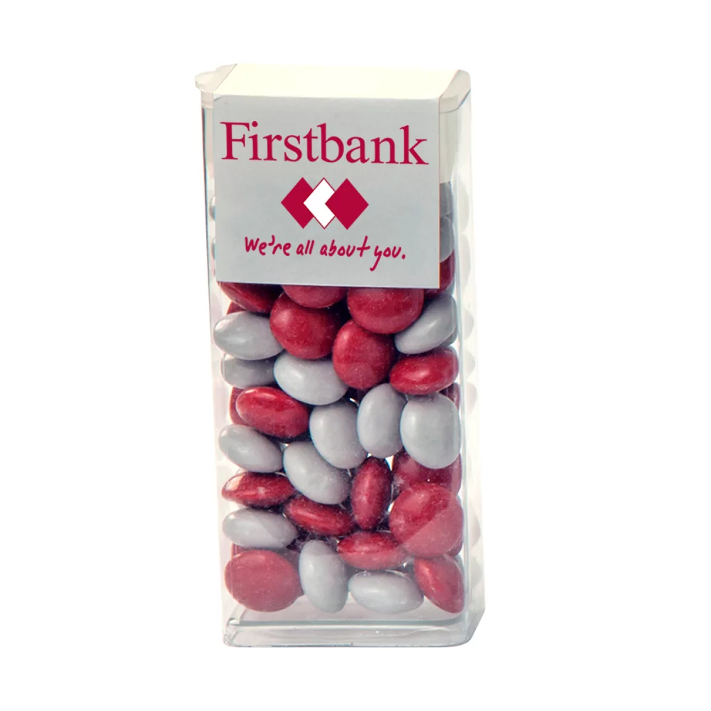 Tube à couvercle rabattable avec des boutons de chocolat