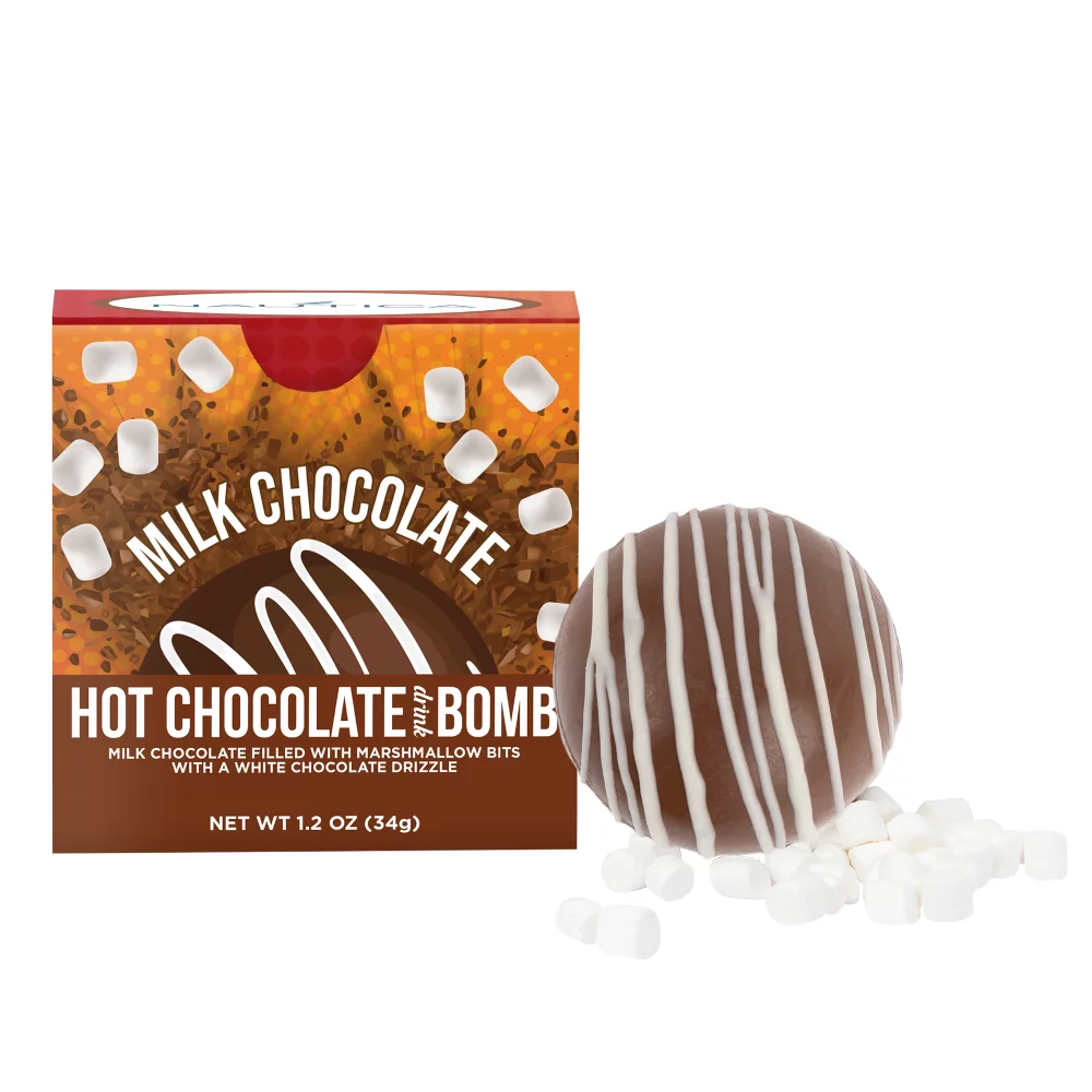 Boule de chocolat chaud dans une boîte cadeau en couleur.